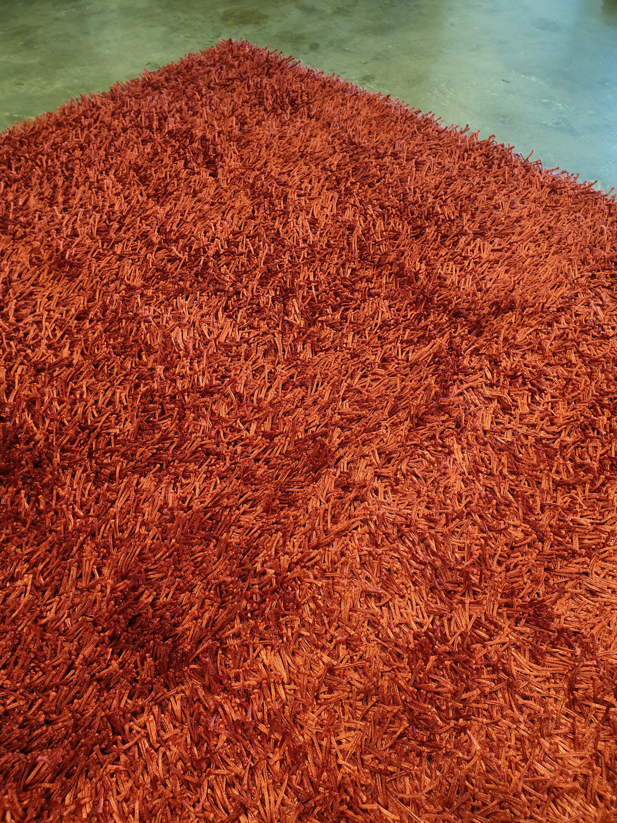 Rouge; a shaggy rug